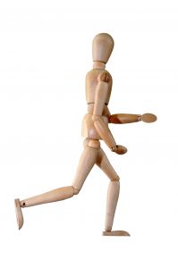 wooden man model looking like it's running away