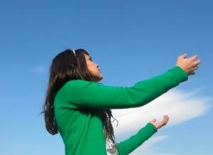 woman reaching to the sky for help