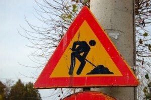 man digging sign