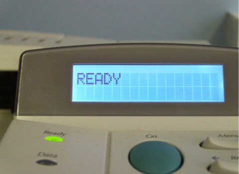 Close up of the 'ready' message from a printer.