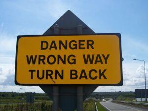 danger wrong way turn back sign