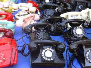 lots of telephones on a table
