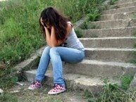 woman crying at bottom of steps