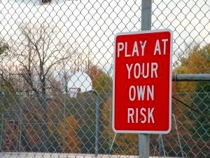 play at your own risk sign