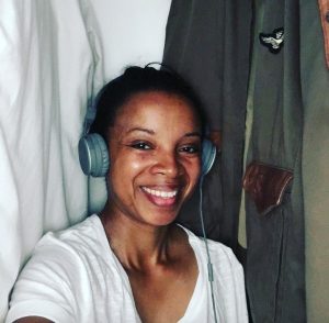 Me recording the podcast in the closet of our Airbnb